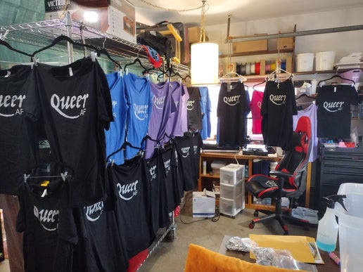 Jaelyn's workshop full of shirts hanging