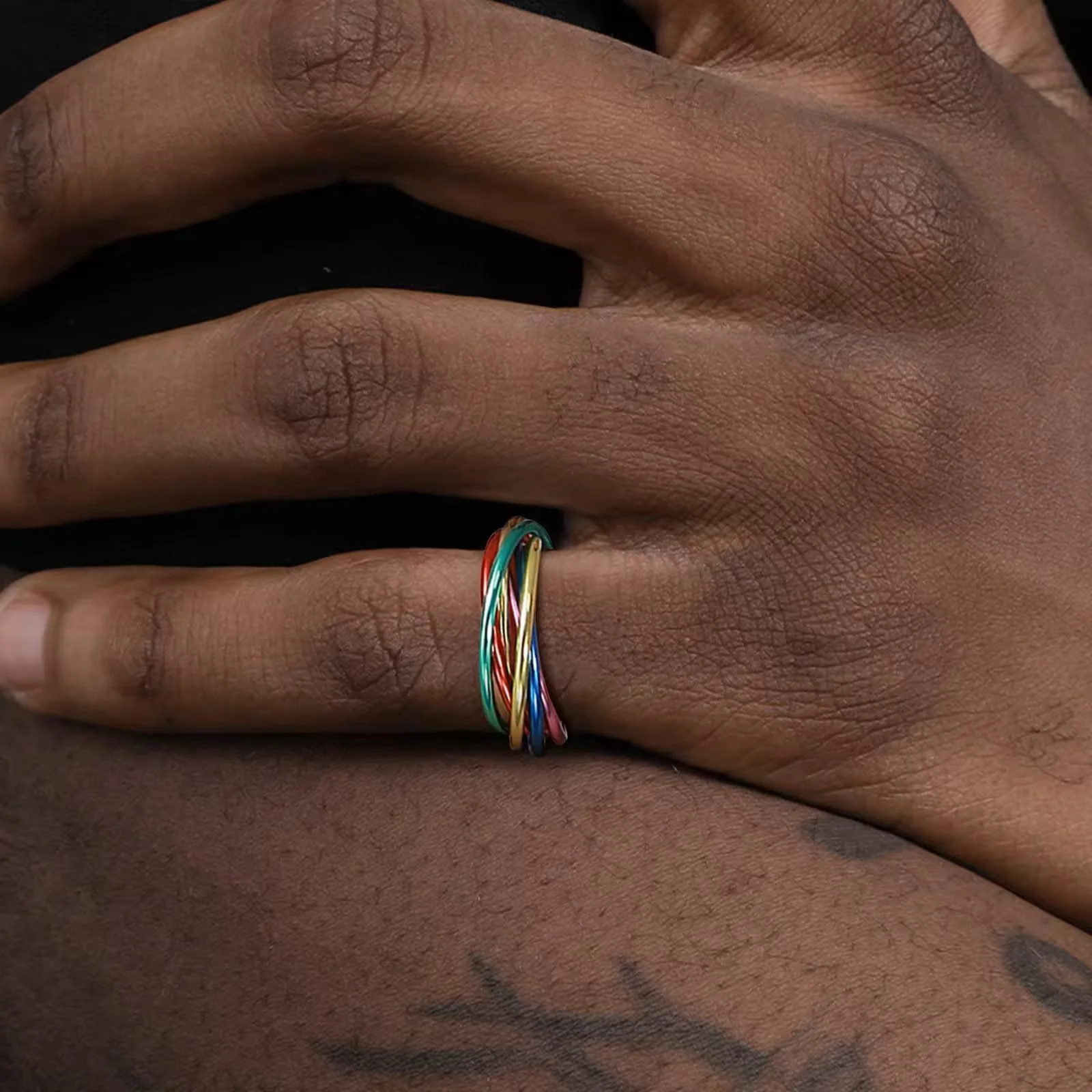 Rainbow Fidget Ring on a hand