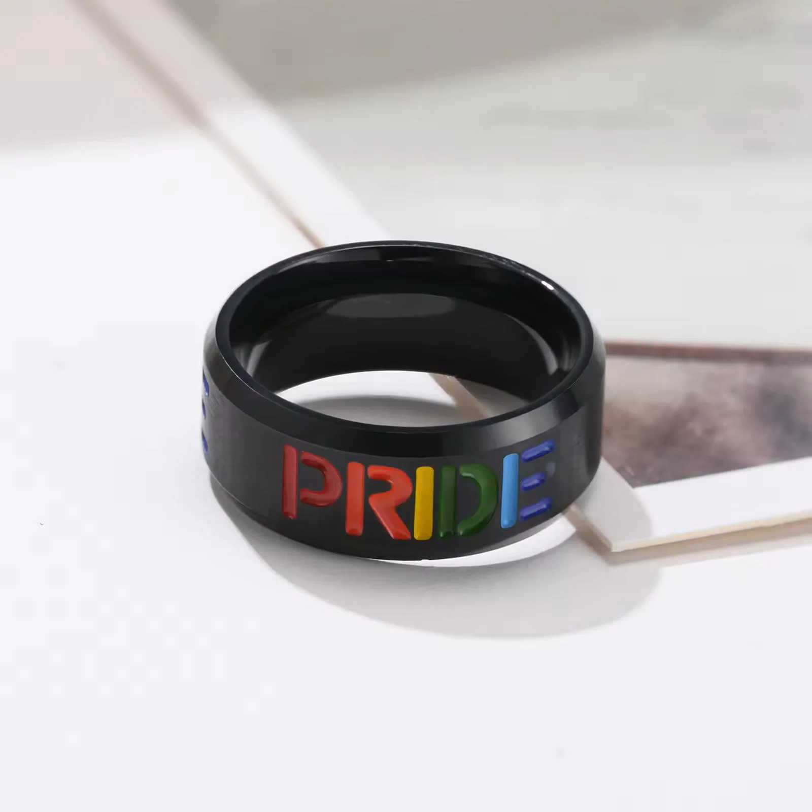 Black on Steel "Pride" Ring on table
