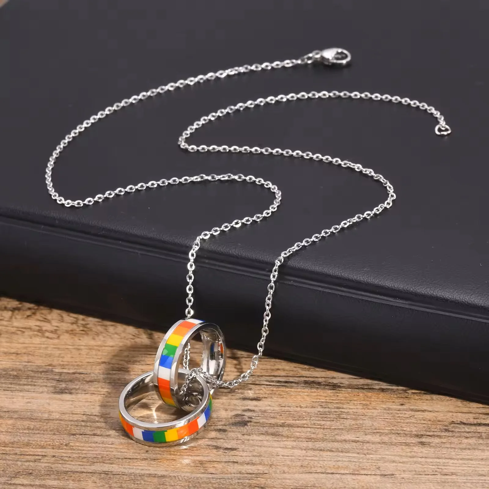 Double Ring Rainbow Pendant on table