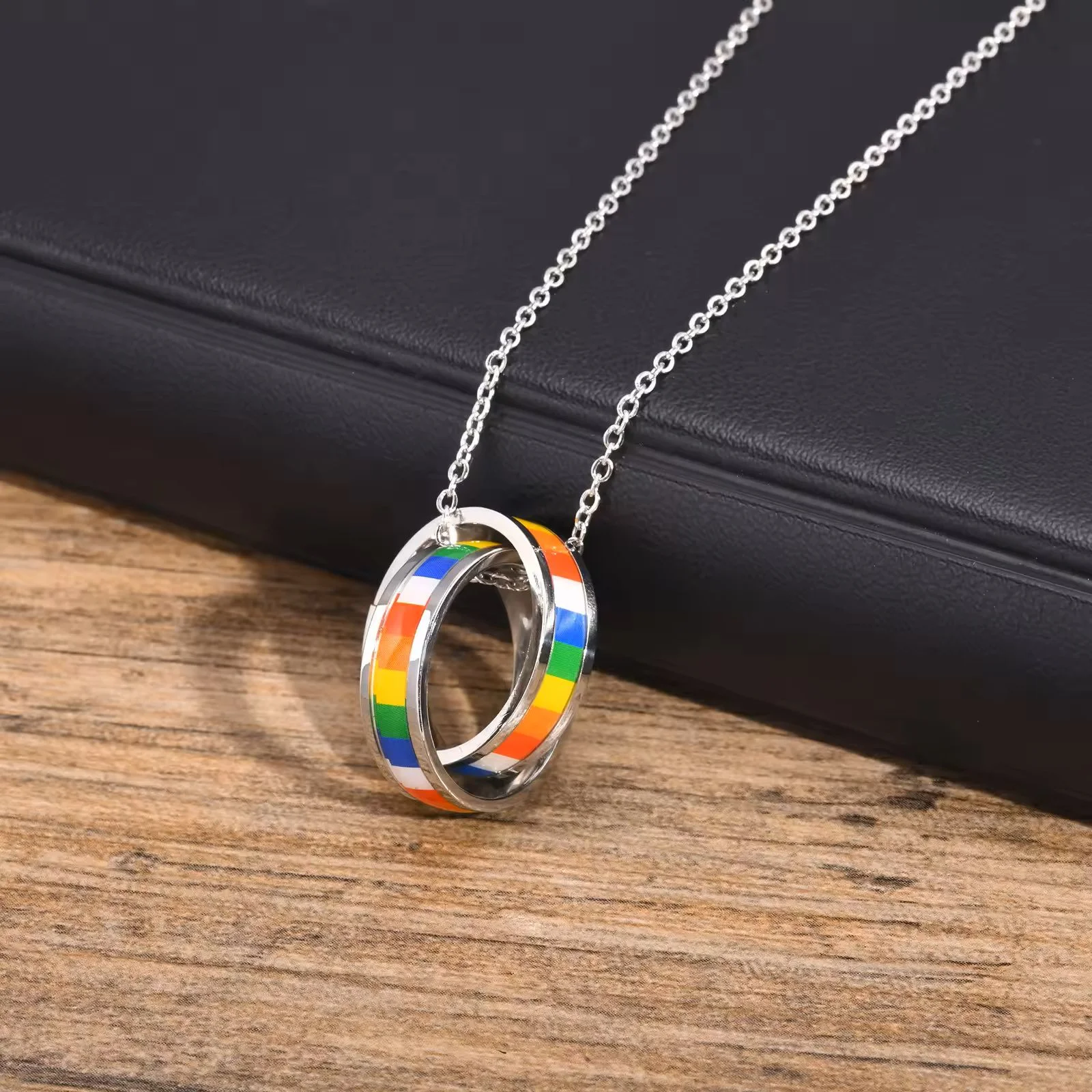 Double Ring Rainbow Pendant on table