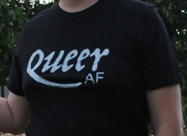 Close up of Jaelyn wearing Queer AF shirt